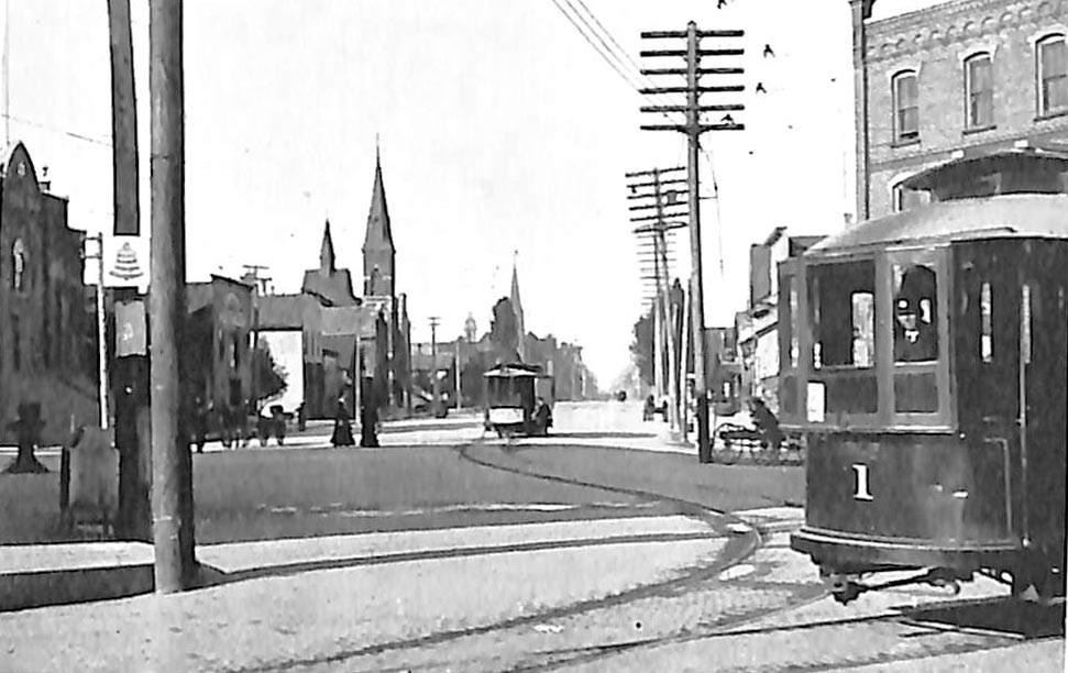 Historic street scene with trolley car in Menominee.